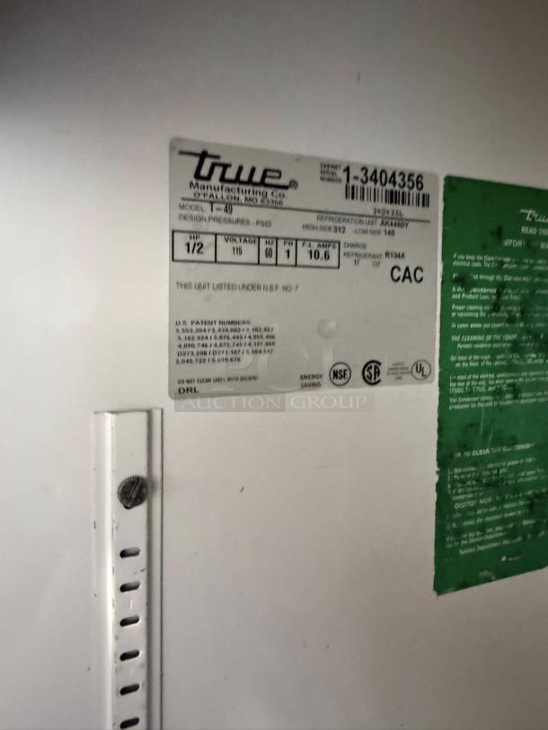 True T-49-HC refrigerator label showing model info, voltage 115v, patents, and green care instructions.