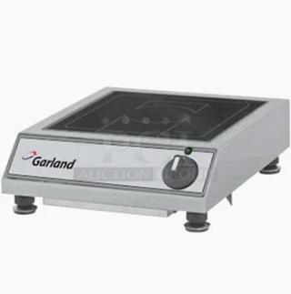 Brand new Garland GIHBA single hob induction cooker, 208/240V, countertop range, unused condition, features Garland logo.