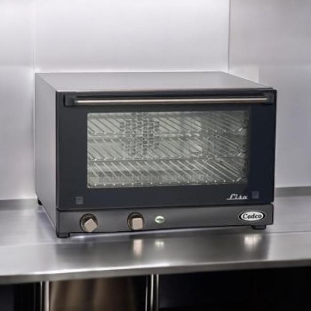 Brand new Cadco OV-013 countertop convection oven, 120V, in original packaging, features stainless steel exterior and glass door.