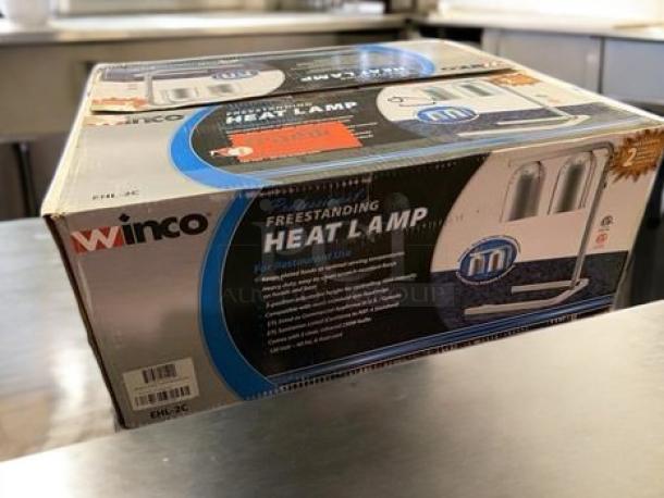 Brand New Winco EHL-2C Dual Bulb Freestanding Heat Lamp in original packaging, 120V, ideal for restaurant use.