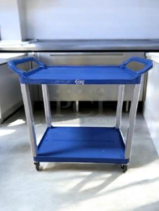 Brand new Choice Equipment Large Bus Cart, blue 2-shelf utility model. Durable, easy to assemble, ideal for storage and transport.