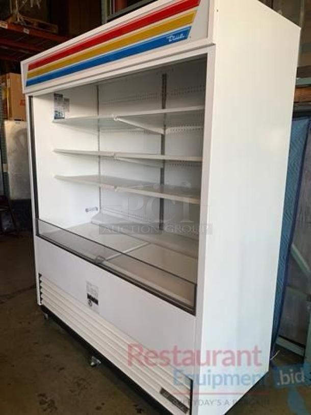 True TAC-72-LD 72" open-air merchandiser in excellent condition; features adjustable shelves and vibrant accent colors; fully tested.