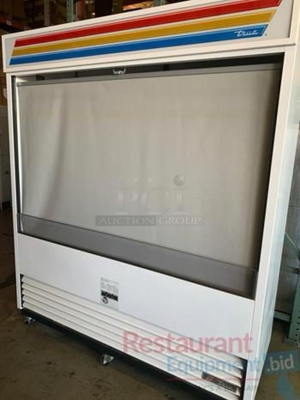 True TAC-72 open-air curtain merchandiser, model TAC-72-LD, in excellent condition. Features vibrant design, 72" wide, 208-230V. Fully tested and working.