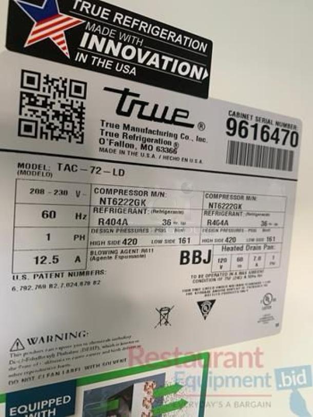 Label on a True TAC-72-LD open-air merchandiser. Indicates model, voltage (208-230V), refrigerant (R404A), and serial number 9616470.