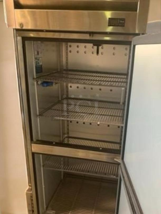 Like-new True T-23-HC single door reach-in refrigerator, stainless steel, multiple shelves, model label visible, 115V, fully tested.