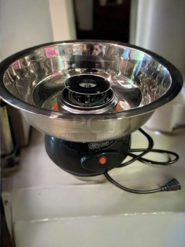 100% Chef Snack Cotton Mini-Pro 600 cotton candy machine, 110V, brand new, fully tested, stainless steel bowl, black base.