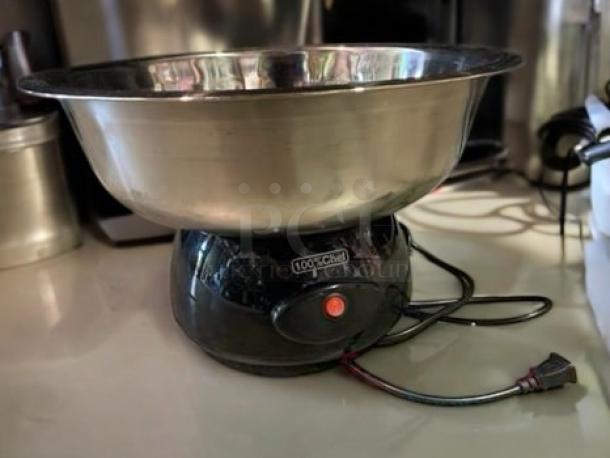 Brand new 100% Chef Snack Cotton Mini-Pro 600 cotton candy machine, 110V, fully tested and working, black base with metal bowl.