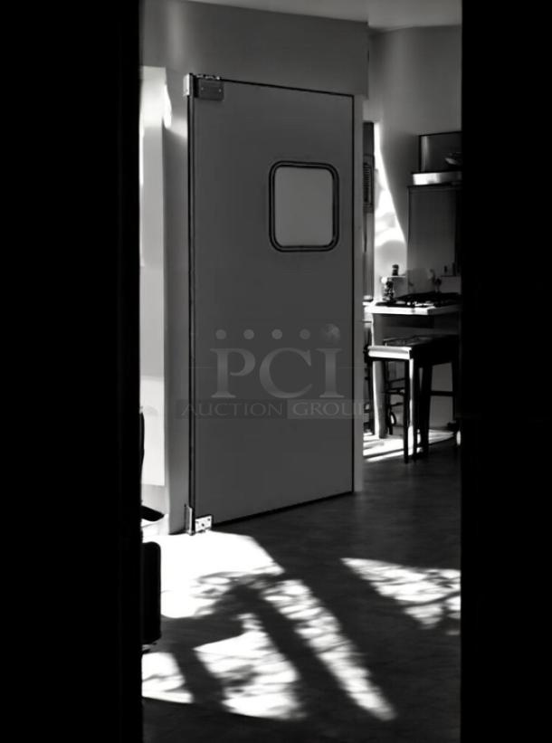 Eliason Swing Traffic Door, 36"W x 80"H, heavy-duty black finish, excellent condition, fully operational.