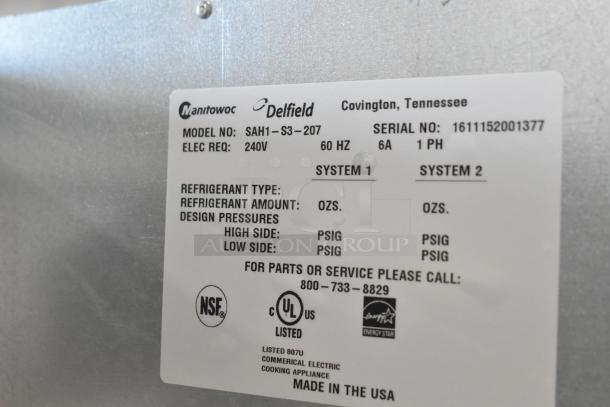 Delfield SAH1-S3-207 stainless steel reach-in heated cabinet, 240V, 1 Phase, label showing model and electrical specs.