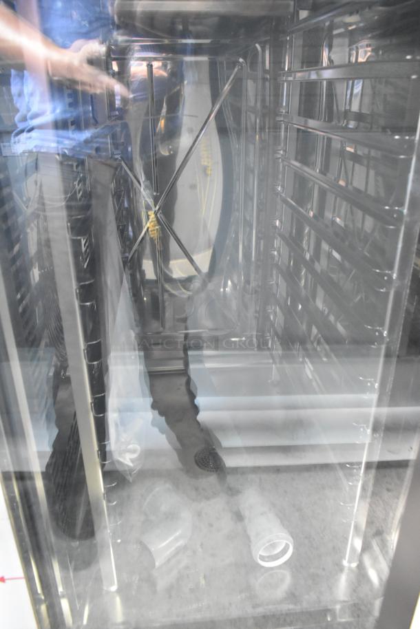 BRAND NEW Scratch/Dent Bakers Pride AETG101R stainless steel combi convection oven. Interior view shows racks and components.