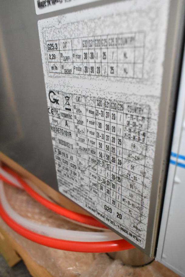 Bakers Pride AETG101R stainless steel commercial combi convection oven, brand new with minor scratches and dents; detailed specs label visible.