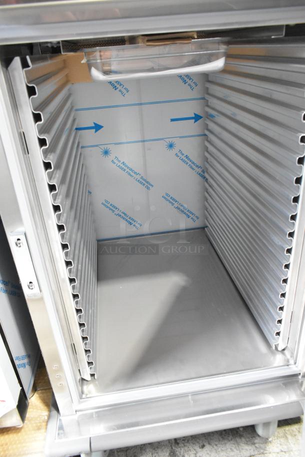 BRAND NEW CresCor H138NPS1816CLA Stainless Steel Heated Holding Cabinet with commercial casters; shows interior shelving.