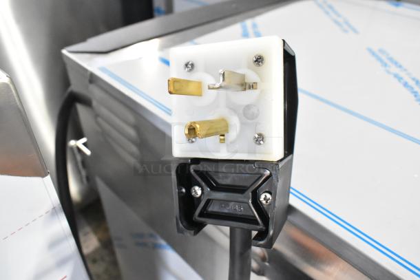 Stainless steel commercial holding cabinet with visible power plug, CresCor model H138NPS1816CLA, 120V, with protective film.