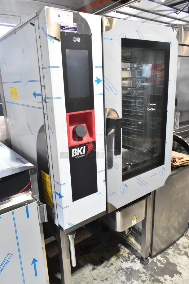 Brand new BKI AETE101DF stainless steel electric combi convection oven, 208V, 3 phase, visible factory packaging, minor dents.