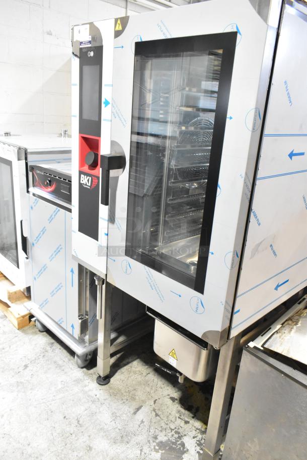BRAND NEW BKI AETE101DF commercial stainless steel combi convection oven, 208V, 3-phase, with visible protective wrapping.