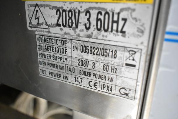 BKI AETE101DF combi oven tag showing 208V, 3-phase, 60Hz power; serial number 005922/05/18. CE and IPX4 rated.