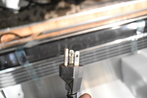 The image shows a power plug for a 2025 Vollrath RDE8160 60" Curved Glass Refrigerated Display Cabinet, 120 Volts, 1 Phase.