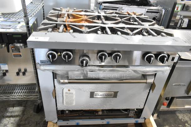 Brand new Garland 372G366CN stainless steel 6-burner range w/ convection oven, shelf, backsplash. 236,000 BTU.