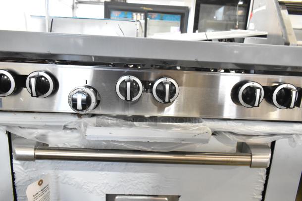 Brand new Garland 372G366CN stainless steel 6-burner range with convection oven, over shelf, backsplash; 236,000 BTU.