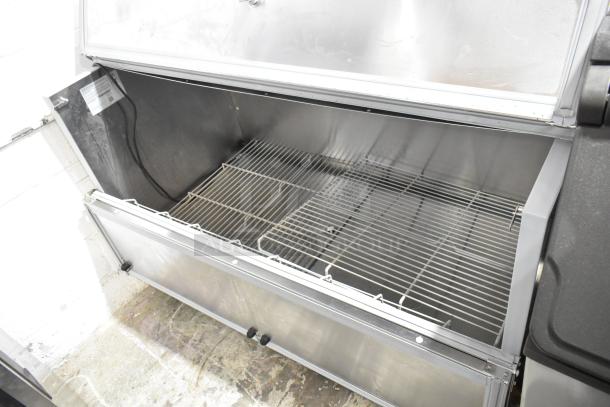 Beverage Air SMF58HC-1-S 58" stainless steel milk cooler, scratch and dent condition, open view, interior shelves visible.
