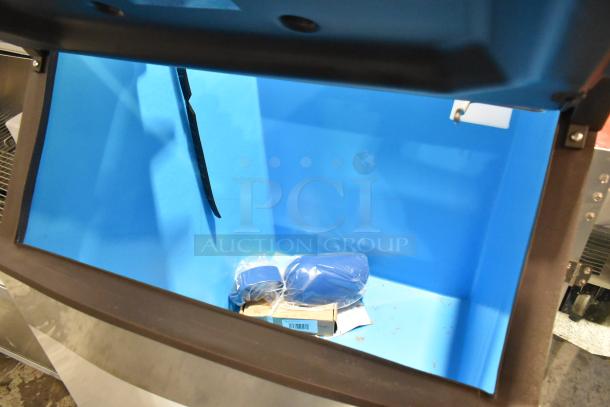 BRAND NEW SCRATCH AND DENT Manitowoc D570 stainless steel ice storage bin, blue interior, 532 lb capacity, visible packaging inside.