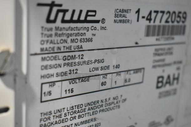 True GDM-12 label indicating model, voltage 115V, and design pressure for commercial reach-in cooler.