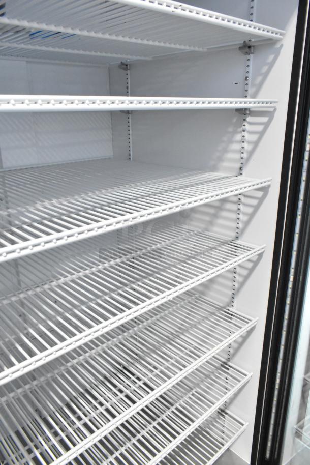 2021 True TSCI-600R-G-PH commercial cooler with glass door, poly-coated wire racks, excellent condition, 115V, 1 phase.