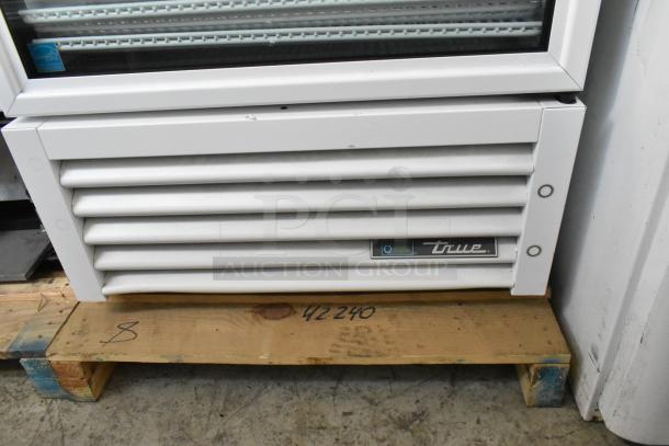 2021 True TSCI-600R-G-PH reach-in cooler, white metal, single door, poly-coated racks, 115V, 1-phase, logo visible.