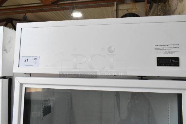 2021 True TSCI-600R-G-PH single door reach-in cooler, glass front, digital display, poly coated racks, 115V, 1 phase.