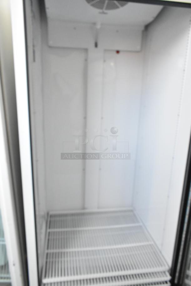 2021 True TSCI-600R-G-PH metal single door cooler merchandiser interior, features poly-coated racks, 115V, 1 phase.
