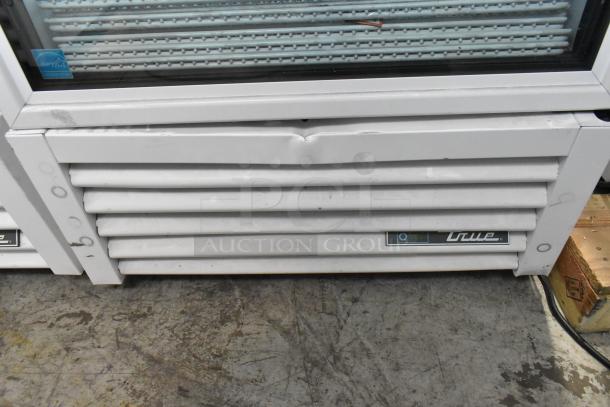 2020 True TSCI-600R-G-PH metal reach-in cooler with poly coated racks, minor dent on vent, 115V, 1 phase, commercial use.