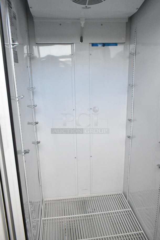 2020 True TSCI-600R-G-PH metal single door cooler with poly-coated racks, 115V, 1 phase. Clean interior and adjustable shelves.