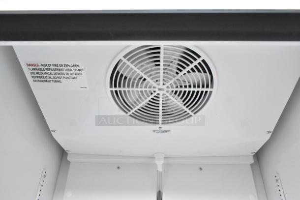 2020 True TSCI-600R-G-PH cooler, featuring fan and warning label detailing flammable refrigerant hazards.