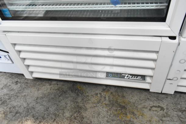2021 True TSCI-600R-G-PH commercial cooler, single door, poly coated racks, True logo, 115V, 1 phase, metal body.