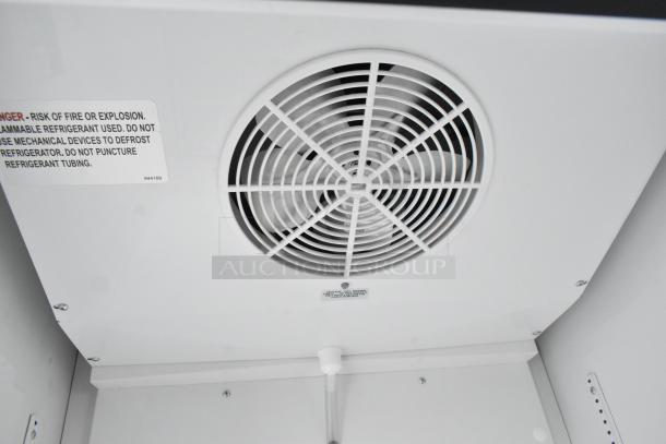 2021 True TSCI-600R-G-PH cooler interior view; features fan vent; label warns of flammable refrigerant risks.