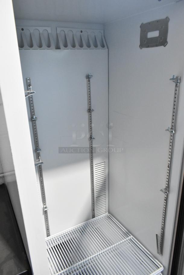 Habco SE12 commercial cooler, single door, metal, with poly-coated racks. 115 volts, 1 phase. Interior view, excellent condition.