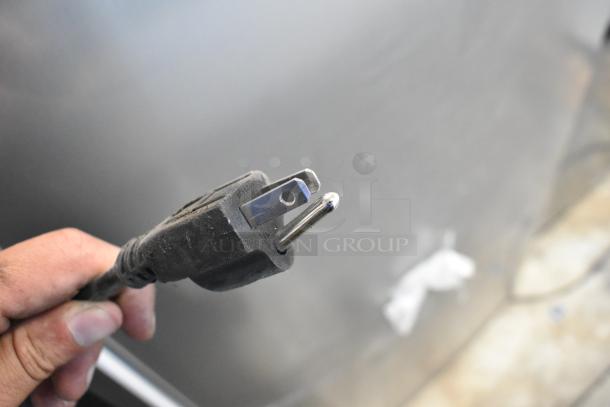 Power plug for Habco SE12 Commercial Single Door Reach In Cooler, 115 Volts, 1 Phase, showing standard three-prong design.