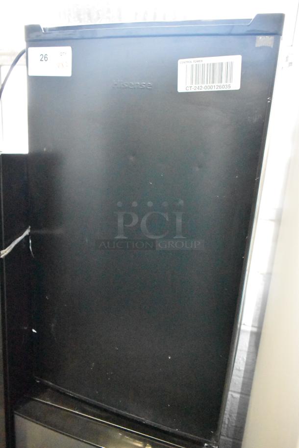 Hisense RR33D6ABE mini cooler, black, 115 volts, 1 phase, visible control tower barcode label, slight wear noted.