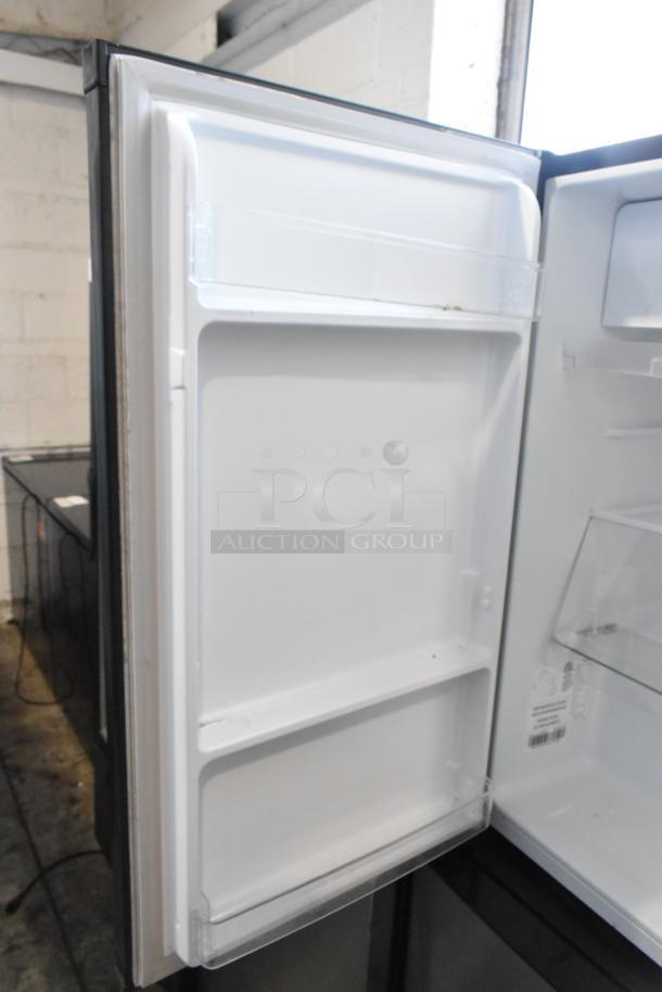Hisense RR33D6ABE Mini Cooler, open door view, showing clean interior shelves. 115 volts, 1 phase.