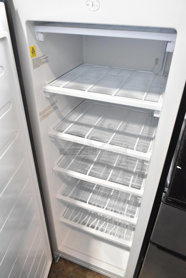 Frigidaire EFRF698-6COM metal reach-in freezer with single door, 5 shelves, 115 volts, 1 phase; excellent condition.