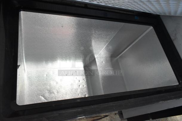 Frigidaire FGFRF7009-B-BLACK metal chest freezer, 115 volts, 1 phase. Spacious interior, black finish, excellent condition.