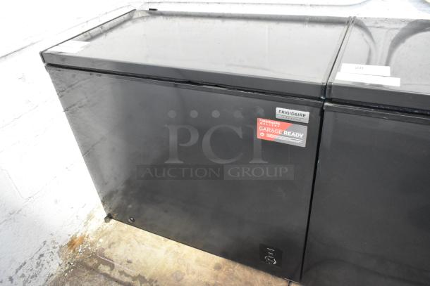 Frigidaire FGFRF7009-B-BLACK metal chest freezer, black finish, 115 volts, garage ready label visible.