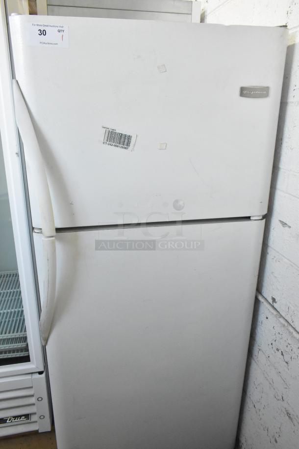 Frigidaire FRT21S6AWH metal cooler with freezer, 115V, 1 phase. Includes visible barcode, worn handle, and logo badge.