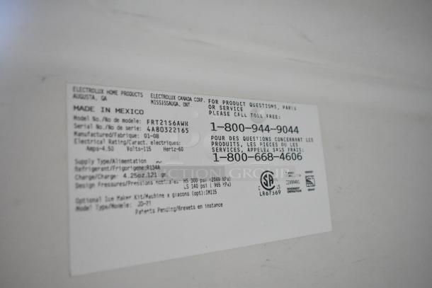 Frigidaire FRT21S6AWH cooler label. Displays model, serial numbers, voltage, and refrigerant type. Made in Mexico.