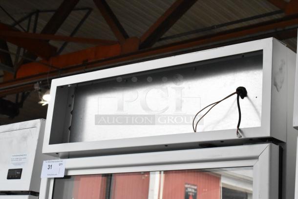 2021 True TSCI-600R-G-PH single door reach-in cooler, metal frame, poly-coated racks, 115 volts, 1 phase, exterior wiring visible.