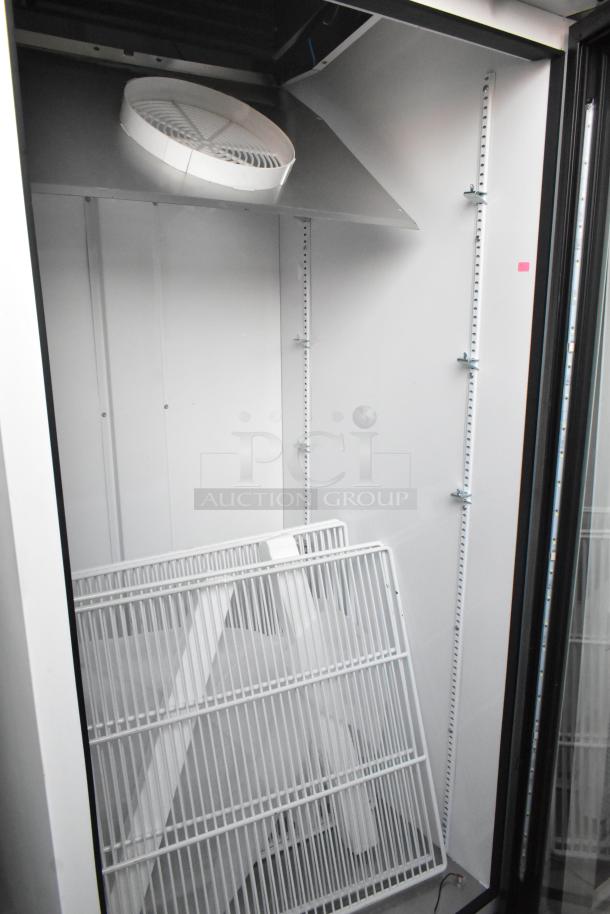 2021 True TSCI-600R-G-PH metal single door cooler merchandiser, poly-coated racks, 115V, 1 phase, excellent condition.