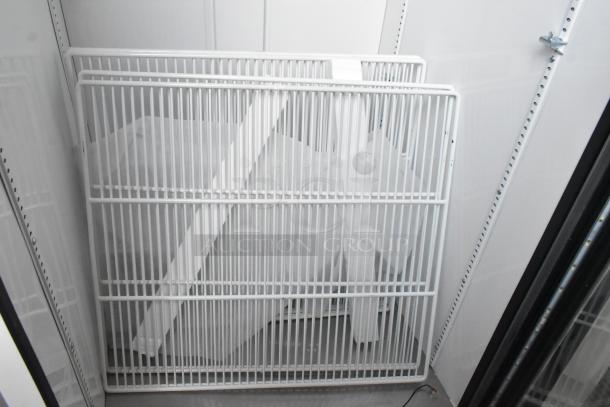 2021 True TSCI-600R-G-PH commercial cooler interior with poly-coated racks, single door, 115V, excellent condition.