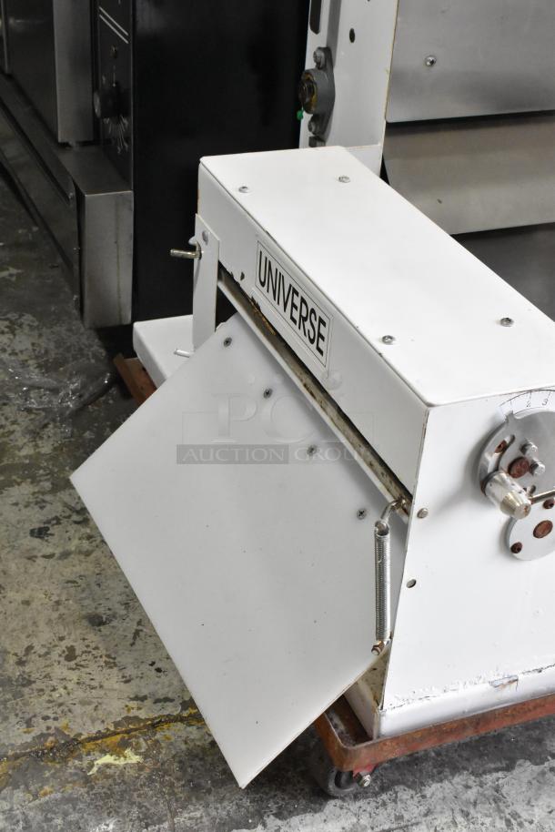 Universe TM18 metal commercial countertop dough sheeter, 115 volts, 1 phase, minor wear, logo visible, used condition.