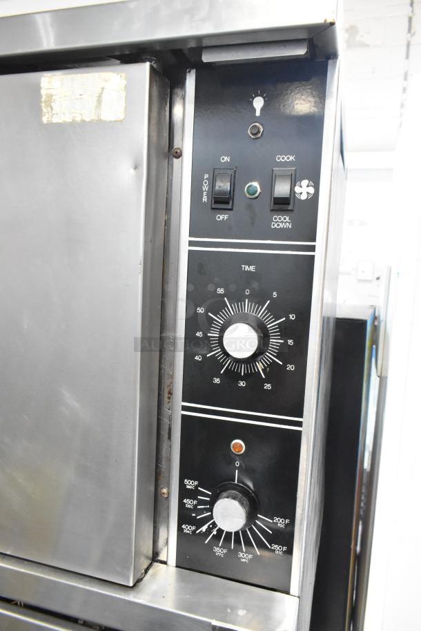Garland stainless steel commercial convection oven; view-through door, solid door, metal racks, thermostatic controls.