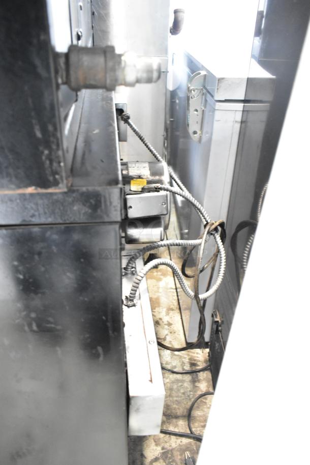 Garland stainless steel commercial convection oven, full size, solid and view-through doors, metal racks, thermostatic controls.